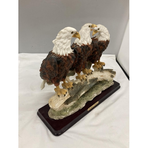 296 - A RESIN MODEL OF A GROUP OF THREE BALD EAGLES ON A BRANCH BY THE JULIANA COLLECTION HEIGHT 29CM, WID... 