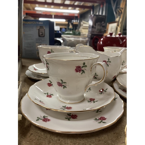 775 - A COLCLOUGH CHINA TEASET WITH A ROSE PATTERN TO INCLUDE A CAKE PLATE, CUPS, SAUCERS, SIDE PLATES, SU... 