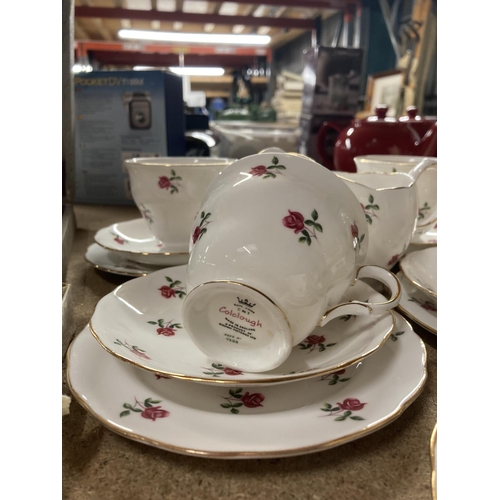 775 - A COLCLOUGH CHINA TEASET WITH A ROSE PATTERN TO INCLUDE A CAKE PLATE, CUPS, SAUCERS, SIDE PLATES, SU... 