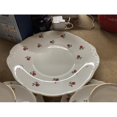 775 - A COLCLOUGH CHINA TEASET WITH A ROSE PATTERN TO INCLUDE A CAKE PLATE, CUPS, SAUCERS, SIDE PLATES, SU... 