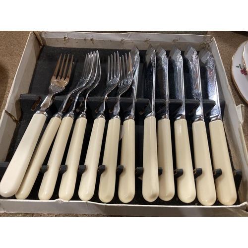 776 - A VINTAGE BOXED KNIFE AND FORK SET WITH MOTHER OF PEARL HANDLES PLUS A SET OF FISH KNIVES AND FORKS