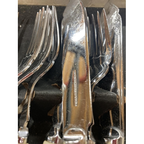 776 - A VINTAGE BOXED KNIFE AND FORK SET WITH MOTHER OF PEARL HANDLES PLUS A SET OF FISH KNIVES AND FORKS