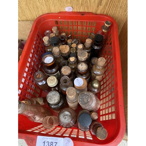 1387 - A LARGE ASSORTMENT OF VINTAGE GLASS BOTTLES AND VARIOUS STOPPERS