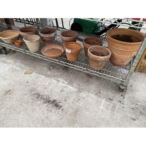 1394 - AN ASSORTMENT OF TERRACOTTA PLANT POTS OF VARIOUS SIZES