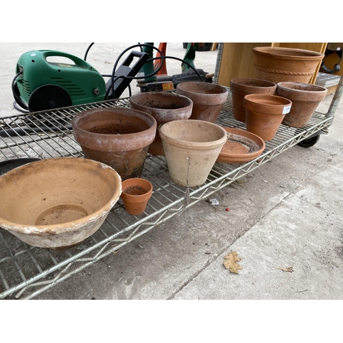 1394 - AN ASSORTMENT OF TERRACOTTA PLANT POTS OF VARIOUS SIZES