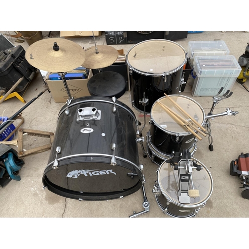 1439 - A TIGER DRUM KIT WITH BASE DRUM, SYMBOLS, SNARE AND DRUM STICKS ETC