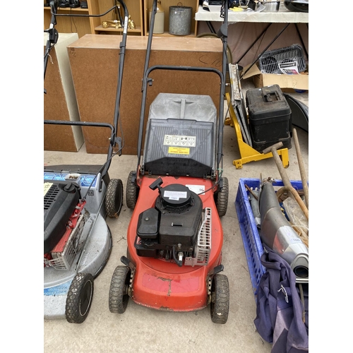 1441 - A PETROL ENGINE LAWN MOWER WITH GRASS BOX BELIEVED IN WORKING ORDER BUT NO WARRANTY