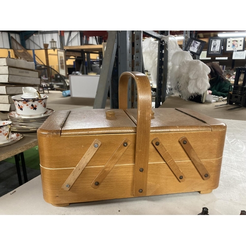 831 - A VINTAGE CANTILEVER SEWING BOX