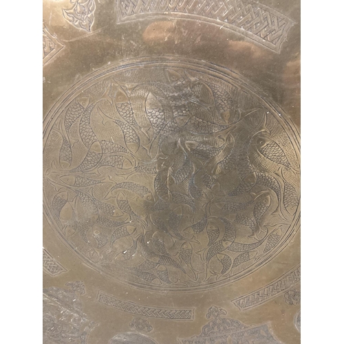 861 - A VERY LARGE BRASS ISLAMIC STYLE CHARGER DIAMETER 68CM