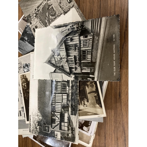 863 - A QUANTITY OF BLACK AND WHITE URBAN POSTCARDS