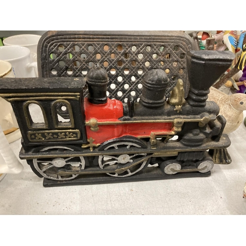 872 - THREE CAST DOORSTOPS TO INCLUDE A STEAM ENGINE, ETC