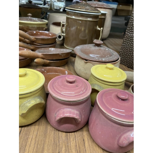 877 - A LARGE QUANTITY OF MAINLY FRENCH STONEWARE PANS, POTS, SERVING DISHES, ETC