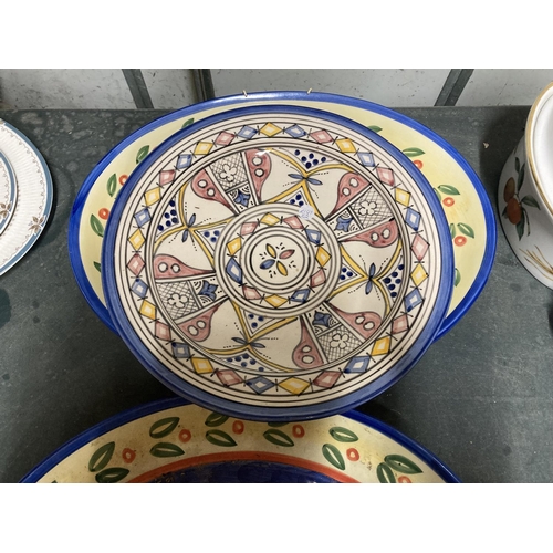 900 - TWO LARGE HANDPAINTED PORTUGUESE PLATTERS PLUS A HANDPAINTED CHARGER