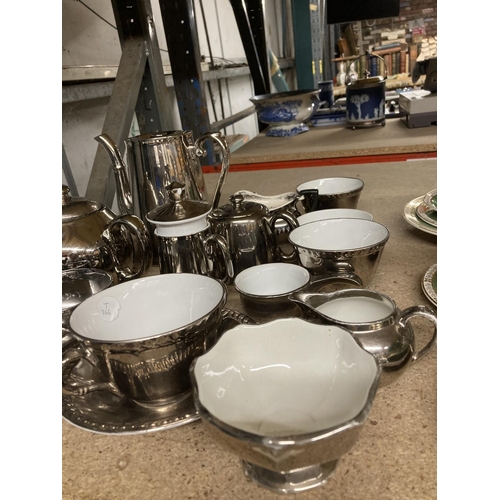 943 - A BURLEIGH WARE AND ROYAL WORCESTER SILVER PORCELAIN PART TEASET TO INCLUDE TEAPOTS, COFFEEPOTS, MIL... 