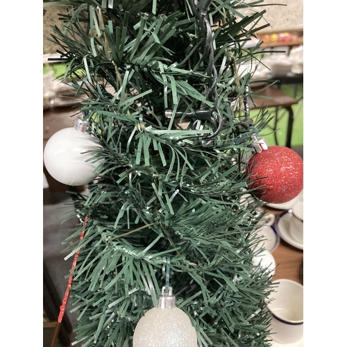 949 - A POP UP CHRISTMAS TREE WITH LIGHTS AND DECORATIONS AND STAND