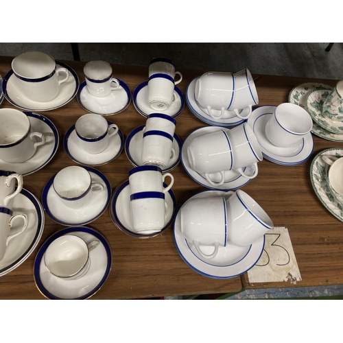 958 - A LARGE QUANTITY OF EMPIRE WARE WHITE AND NAVY CUPS AND SAUCERS