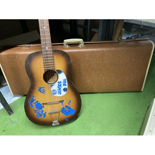 969 - A VINTAGE ACOUSTIC GUITAR AND CASE