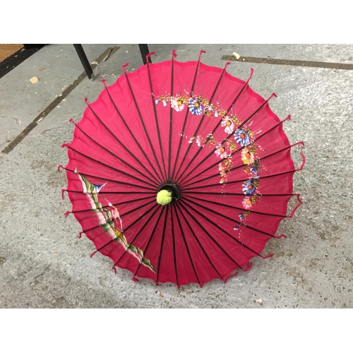 180 - TWO LARGE HANDPAINTED EASTERN FANS AND A HANDPAINTED PARASOL