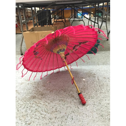 180 - TWO LARGE HANDPAINTED EASTERN FANS AND A HANDPAINTED PARASOL