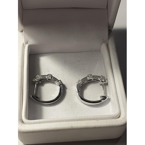 501 - A PAIR OF MARKED 18 CARAT WHITE GOLD HOOP EARRINGS ENCRUSTED WITH DIAMONDS IN A PRESENTATION BOX