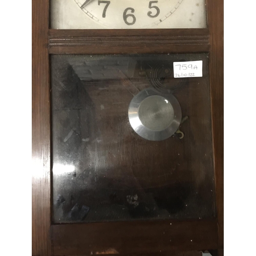 759A - A VINTAGE WALL CLOCK IN A MAHOGANY CASE WITH PENDULUM AND KEY