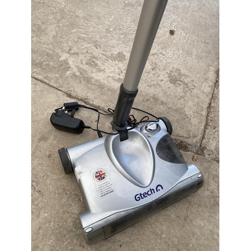 A GTECH VACUUM CLEANER WITH CHARGER