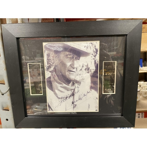 904 - THREE FRAMED JOHN WAYNE PRINTS AND STILLS