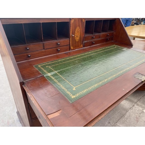 2719 - A 19TH CENTURY MAHOGANY INLAID AND CROSSBANDED BUREAU WITH FITTED INTERIOR AND FOUR GRADUATED DRAWER... 