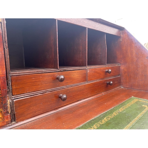 2719 - A 19TH CENTURY MAHOGANY INLAID AND CROSSBANDED BUREAU WITH FITTED INTERIOR AND FOUR GRADUATED DRAWER... 