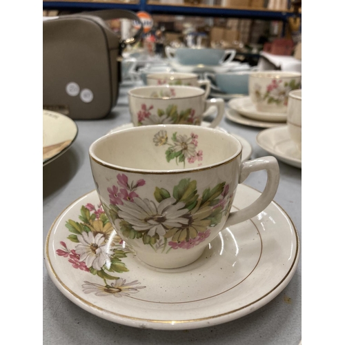 143 - A QUANTITY KIRKLANDS EMBASSY WARE TO INCLUDE FLORAL PATTERN CUPS, SAUCERS AND SIDE PLATES