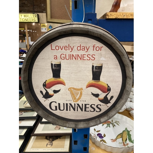 290 - A WOODEN BARREL TOP GUINNESS SIGN DIAMETER 37.5CM