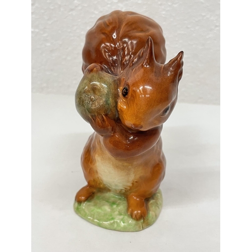 330 - A BESWICK BEATRIX POTTER FIGURE SQUIRREL NUTKIN WITH GOLD BACK STAMP