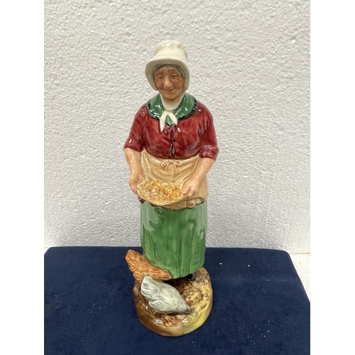 396 - A ROYAL DOULTON FIGURE THE FARMERS WIFE  HN 2069