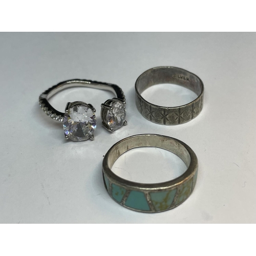 527 - FIVE MARKED SILVER RINGS THREE WITH LARGE CLEAR STONES