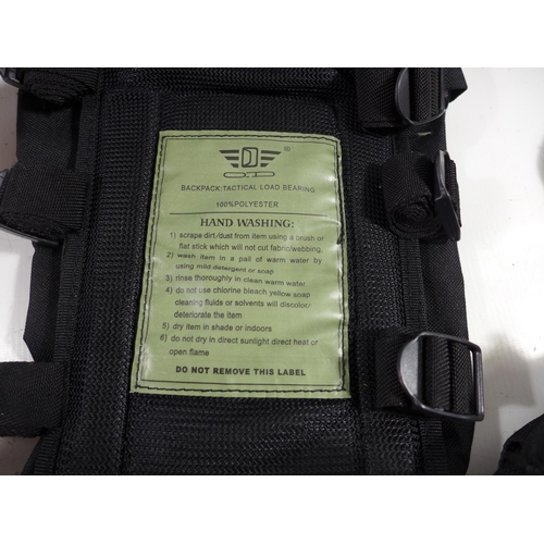 348 - A BLACK TACTICAL LOAD BEARING VEST, WITH NUMEROUS POUCHES