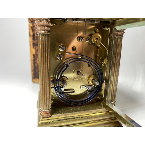 1 - A SMALL ANTIQUE FRENCH BRASS CASED CARRIAGE CLOCK WITH CORINTHIAN COLUMN SUPPORTS AND CICRCULAR ENAM... 