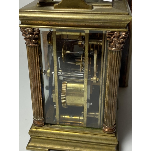 1 - A SMALL ANTIQUE FRENCH BRASS CASED CARRIAGE CLOCK WITH CORINTHIAN COLUMN SUPPORTS AND CICRCULAR ENAM... 