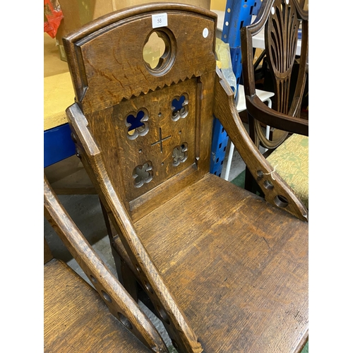 58 - A PAIR OF ECCLESIASTICAL ARTS & CRAFTS OAK ARMCHAIRS