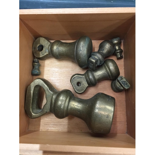 146 - A WOODEN BOX CONTAINING BRASS WEIGHTS