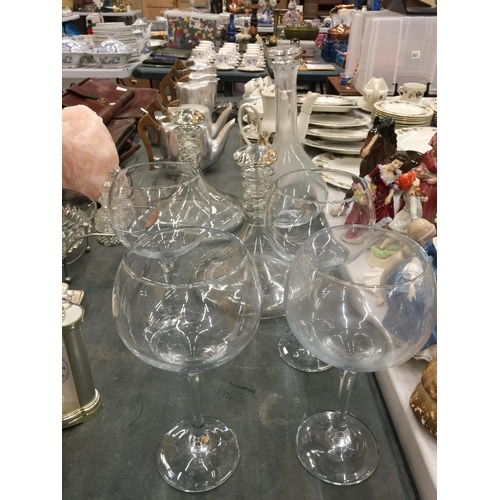 175 - TWO LARGE SHIPS DECANTERS, A LARGE DECANTER AND FOUR LARGE WINE/GIN GLASSES