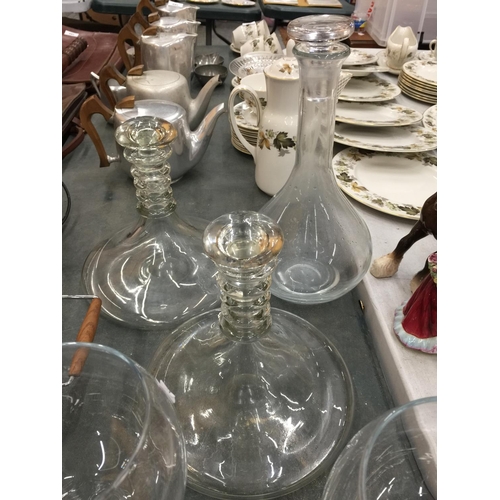 175 - TWO LARGE SHIPS DECANTERS, A LARGE DECANTER AND FOUR LARGE WINE/GIN GLASSES