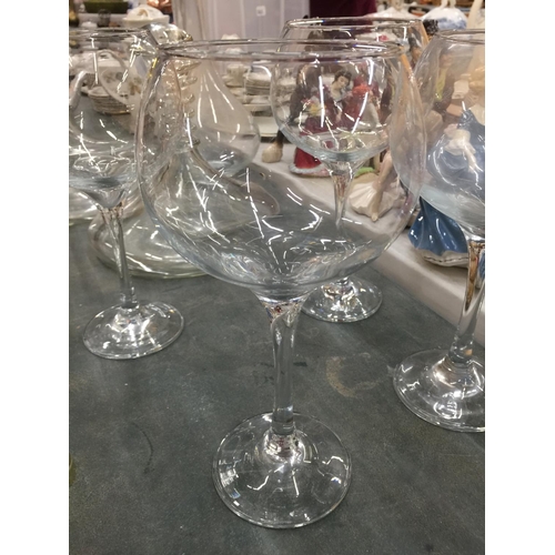 175 - TWO LARGE SHIPS DECANTERS, A LARGE DECANTER AND FOUR LARGE WINE/GIN GLASSES