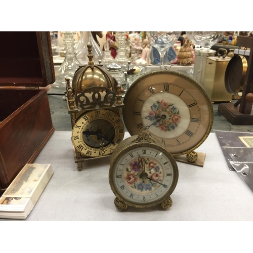 180 - THREE VINTAGE CLOCKS TO INCLUDE A BRASS LANTERN CLOCK, A PETIT POINT MANTLE CLOCK AND ALARM CLOCK