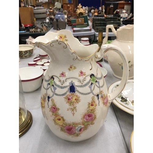 191 - TWO VICTORIAN LIDDED TUREENS (A/F AGE RELATED CRACKS) AND A LARGE DECORATIVE DEVON WARE JUG