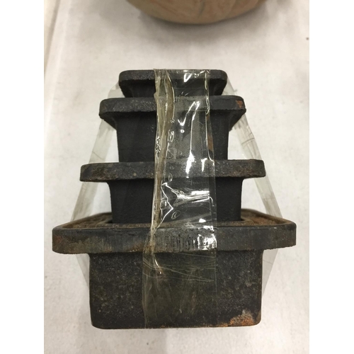 195 - A SET OF FOUR CAST IRON WEIGHTS