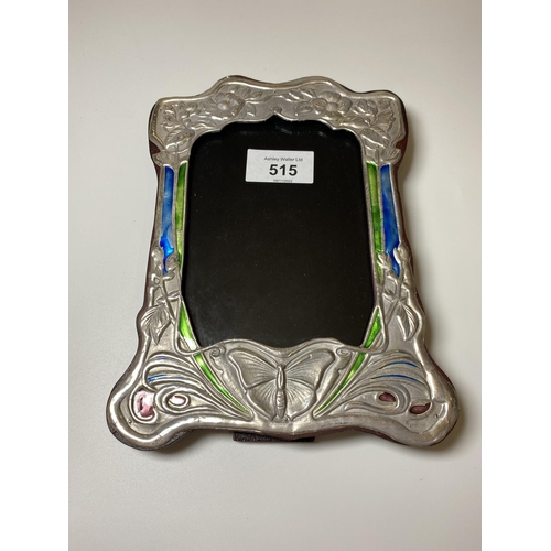 515 - AN ART NOUVEAU STYLE SILVER PHOTO FRAME WITH ENAMEL DESIGN