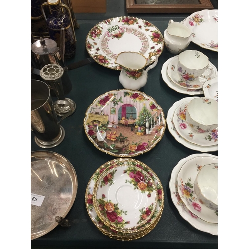 64 - A COLLECTION OF VARIOUS CERAMICS TO INCLUDE ROYAL CROWN DERBY POSIES TRIOS, SUGAR, MILK, CAKE PLATE ... 