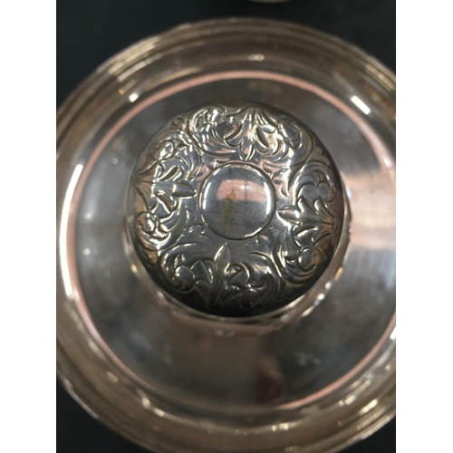 71 - A CUT GLASS AND SILVER PLATED INKWELL FIXED TO A TRAY ON THREE DECOTTIVE FEET