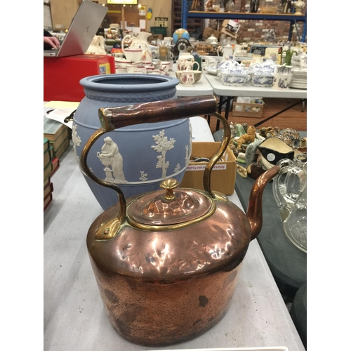 84 - A VINTAGE BRASS AND COPPER KETTLE