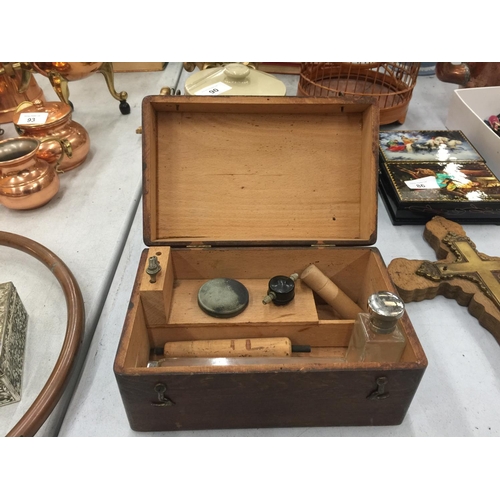 89 - A WOODEN BOX AND CONTENTS TO INCLUDE TWO SILVER PLATED TOP BOTTLES